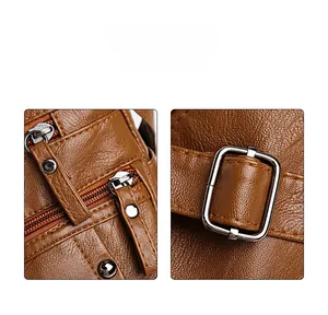 Detailed macro view of brown leather bag featuring high-quality metal zipper and buckle