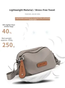 Detailed view of grey waterproof oxford fabric shoulder bag highlighting lightweight 250g weight