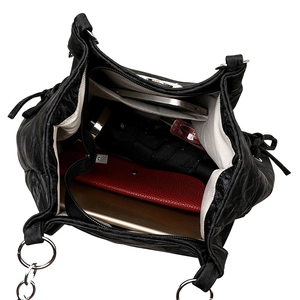 Black leather tote bag with large capacity showing interior storage for daily essentials