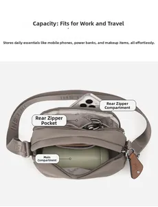 Detailed top view of a khaki nylon crossbody bag showing multiple inner compartments and zippers