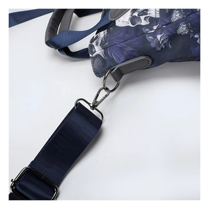 Detail of skull floral print on oxford fabric with silver metal buckle and nylon strap