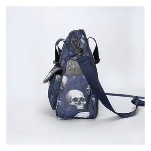 Detail of navy tote bag with skull print showing side pocket capacity for a smartphone