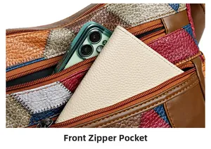Dettaglio tasca frontale con zip della borsa a tracolla vintage in pelle patchwork