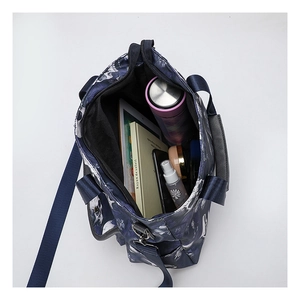 Spacious tote bag interior showing capacity for tablet, books, and daily essentials