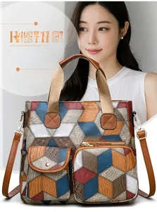 Close-up of vintage multi-pocket shoulder bag with colorful 3D geometric cube patterns