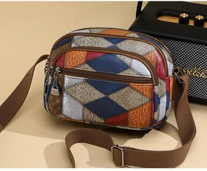 Detail of retro color-block crossbody bag with multi-zipper pockets and canvas strap