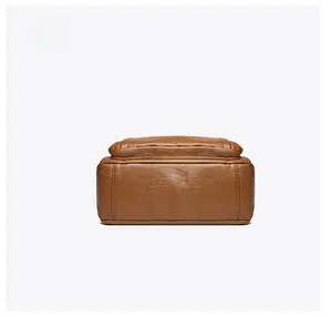 Detailed bottom view of soft brown leather tote bag with premium stitching and texture