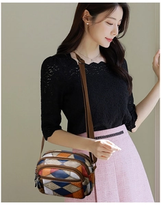 Detailed view of a multi-pocket crossbody bag with vintage color-block patchwork patterns