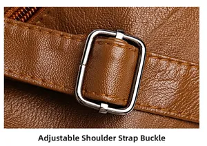 Close-up of brown pebbled leather texture and adjustable silver metal strap buckle