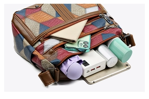 Top-down view of spacious multi-pocket patchwork leather bag showing large storage capacity