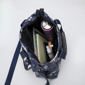 Large blue tote bag with skull print and spacious interior for daily essentials