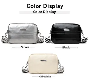Three sleek crossbody bags with silver, black, and beige metallic finish and wide straps