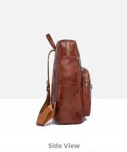 Side view of dark brown leather backpack showing vintage stitching and metallic zippers