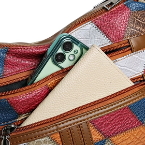 Retro multi-color patchwork leather crossbody bag showing large front pocket capacity
