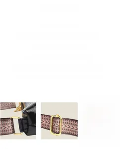 Detail view of adjustable geometric strap and triple golden zippers on black leather bag
