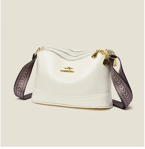 Detail of white textured leather bag with three zippers and golden kangaroo logo
