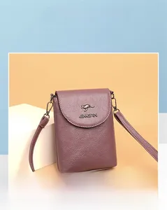 Detail of purple lychee textured leather crossbody phone bag with golden kangaroo logo