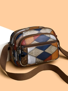 Retro multi-zipper crossbody bag with colorful patchwork and textured synthetic leather