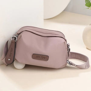 Water-resistant pink oxford cloth crossbody bag with adjustable wide strap by JIELSHI