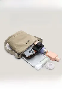Internal display of multi-layer nylon bucket bag showing large storage capacity