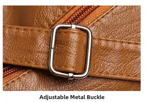 Detail of adjustable metal square buckle on brown pebbled leather shoulder strap