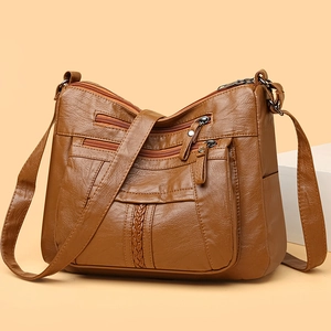 Brown soft leather crossbody bag for women with multi-zipper pockets and woven detail