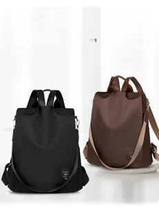 Detailed comparison of black and brown water-resistant Oxford fabric anti-theft backpacks