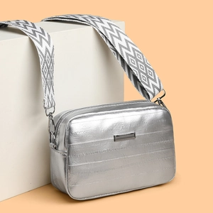 Silver metallic leather crossbody bag with adjustable geometric patterned wide strap