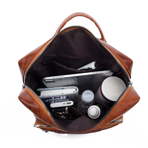 Brown lychee leather backpack with multi-compartment interior for tablets and daily essentials