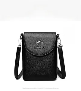 Detail of black lychee textured faux leather phone bag with metallic kangaroo logo