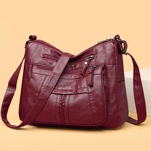 Elegant deep wine red soft PU leather crossbody bag with multiple zippers and woven detail