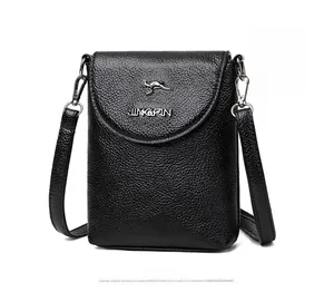 Close-up of black lychee grain leather phone bag featuring a metal kangaroo logo and strap