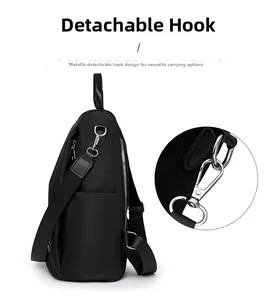 Detail of silver hardware hook on black waterproof oxford backpack with detachable strap
