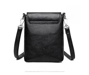 Detailed back view of a black lychee texture leather mini crossbody phone bag with strap