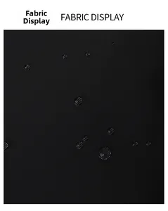 Detailed macro view of black waterproof oxford fabric with water droplets on surface