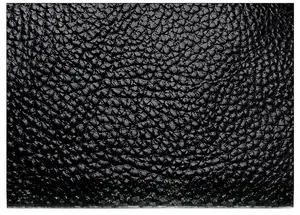 Close-up of black lychee grain faux leather showing soft texture and fine matte finish