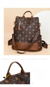 Close-up of leather handle and clover pattern on vintage brown multifunctional backpack
