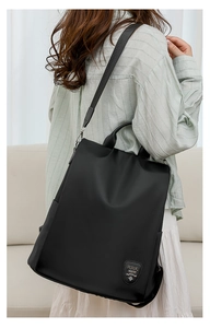 Close-up of a black waterproof oxford backpack featuring a secure anti-theft design