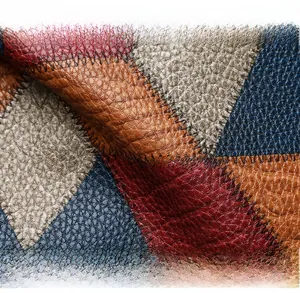 Dettaglio macro delle cuciture in pelle martellata multicolore e dei fini fili neri