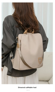 Chic beige oxford fabric backpack worn by a model in a minimalist home interior setting