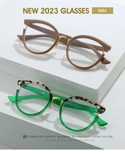 Detail of cat eye glasses frames with metal bridge and leopard print accents
