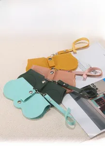 Detail of colorful PU leather sunglasses pouches with metal snaps and carry straps