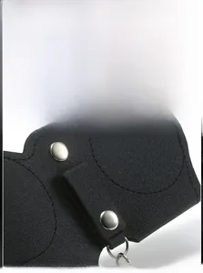 Detailed view of black lychee leather glasses pouch with silver metal snap button closure