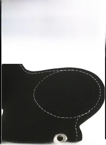 Detail of soft black corduroy lining with white stitching and metal snap fastener