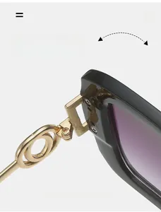 Detail view of durable metal gold-tone hinge and ring design on square sunglasses