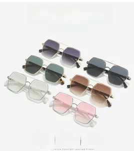 Flat lay of square rimless sunglasses with metal frames in various gradient lens colors