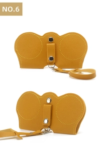 Dual-view macro of mustard yellow leather sunglasses pouch with metal snap buttons