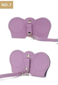 Detail of purple leather sunglasses pouch with metal snap button and long lanyard strap