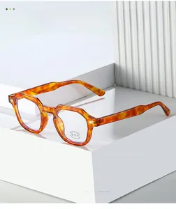 Detail of retro amber tortoiseshell glasses frames with anti-blue light functional lens