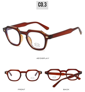 Macro shot of amber tortoise geometric eyeglass frames with anti-blue light lens stickers